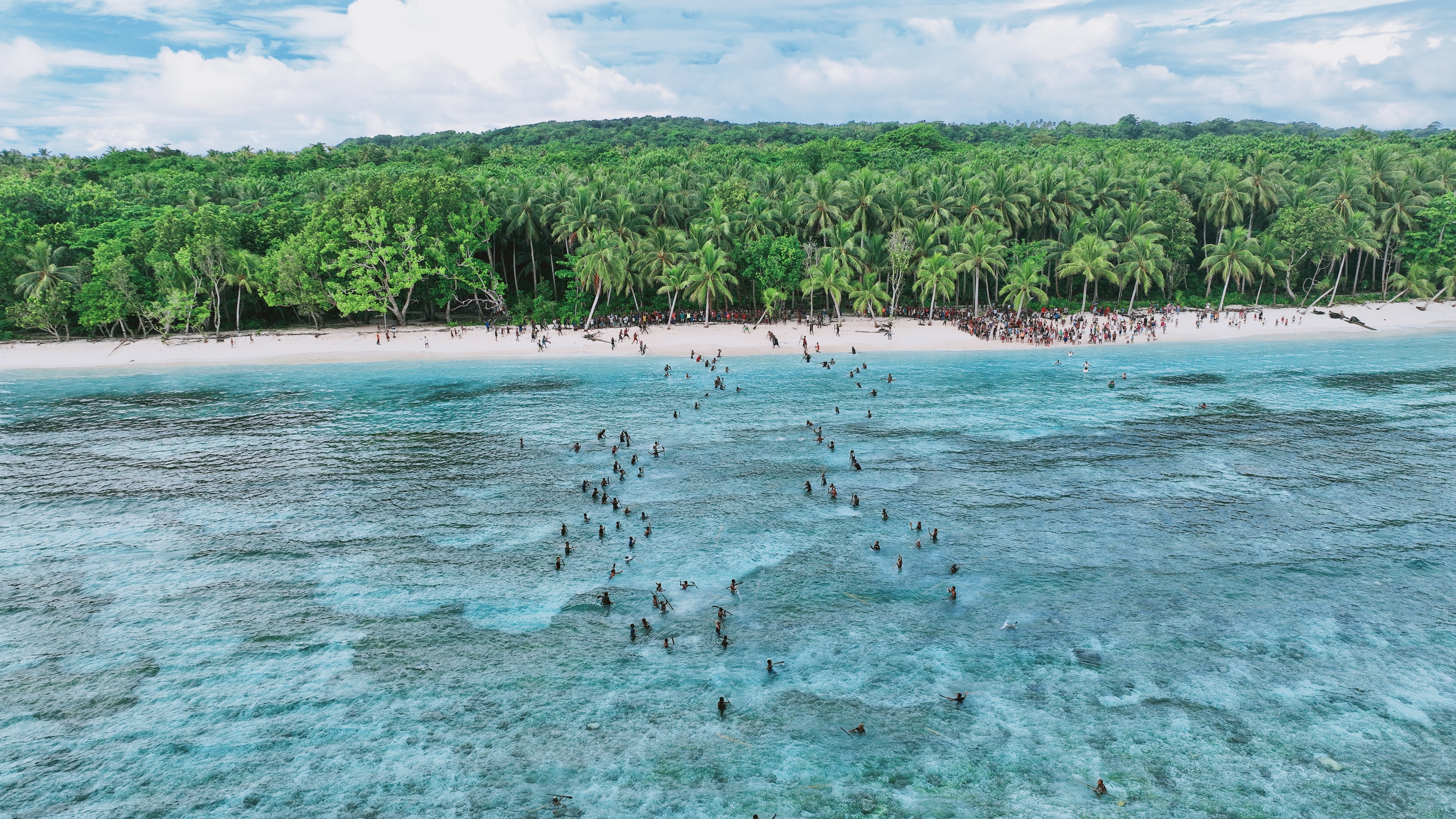 A drone shot of people on an island 