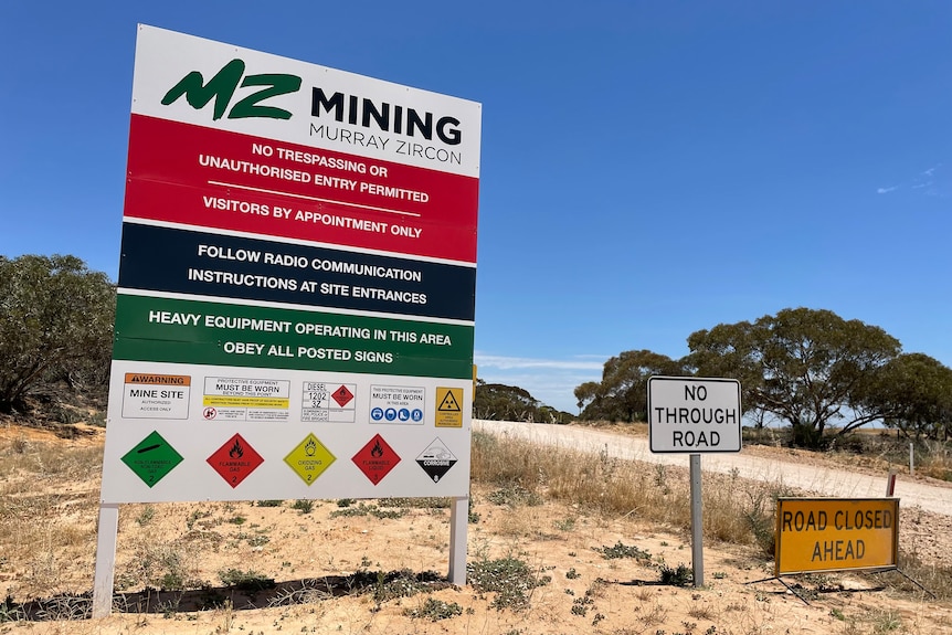Mid shot of Murray Zircon mining sign at entry road at Mercunda.