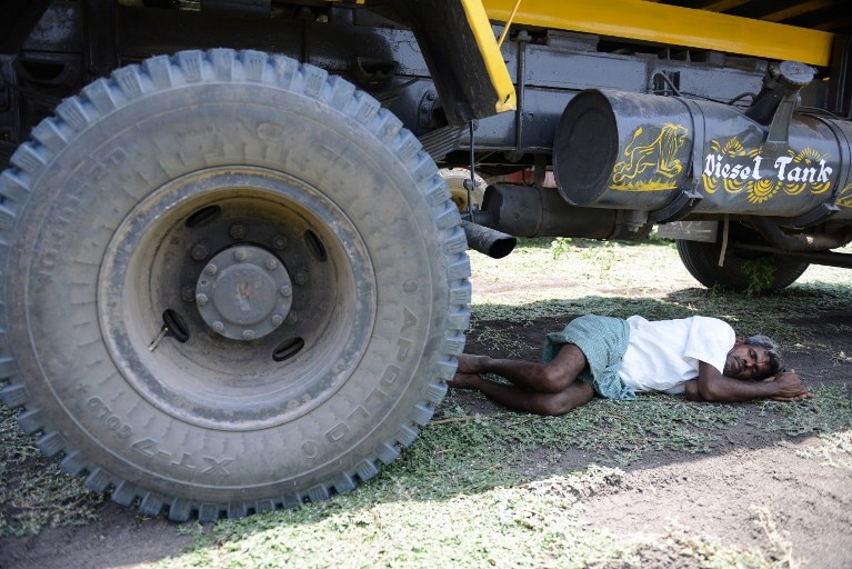 Indian man sleeps during heatwave