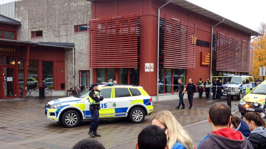 Swedish police officers outside the school in Trollhattan