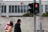 Locals walk in front of 'Unit 61398', a secretive Chinese military unit, in the outskirts of Shanghai.