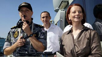 Prime Minister Julia Gillard and David Bradbury MP watch a vessel boarding exercise in Darwin Harbour (AAP)