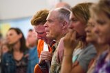 A group cries in the church after the Texas school shooting