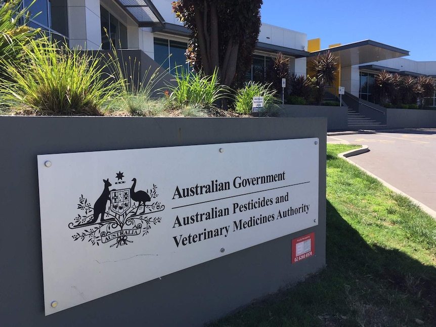 A sign that says "Australian Pesticides and Veterinary Medicines Authority" on a wall outside a government building.