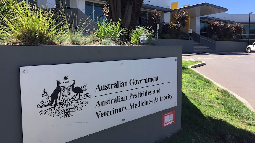 A sign that says "Australian Pesticides and Veterinary Medicines Authority" on a wall outside a government building.