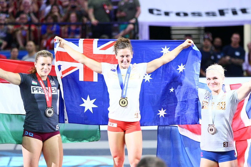 Australia's Tia-Clair Toomey stands on the top podium at the 2019 CrossFit Games.