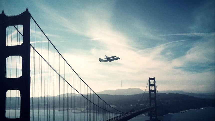 The retired space shuttle Endeavour is carried over the Golden Gate Bridge in San Francisco.