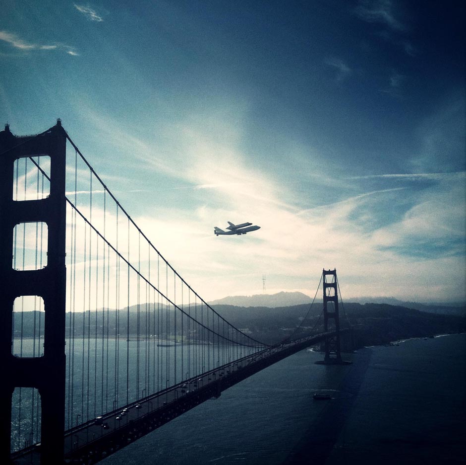 The retired space shuttle Endeavour is carried over the Golden Gate Bridge in San Francisco.