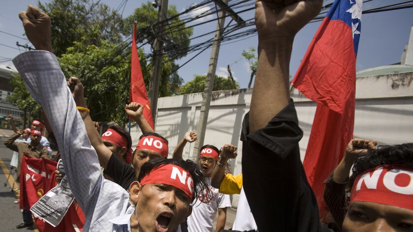 Burma nationals living in Thailand hold a demonstration against the referendum.
