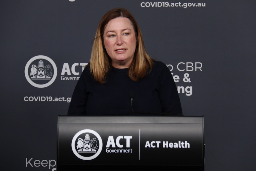Yvette speaks behind a lectern at an ACT government press conference.