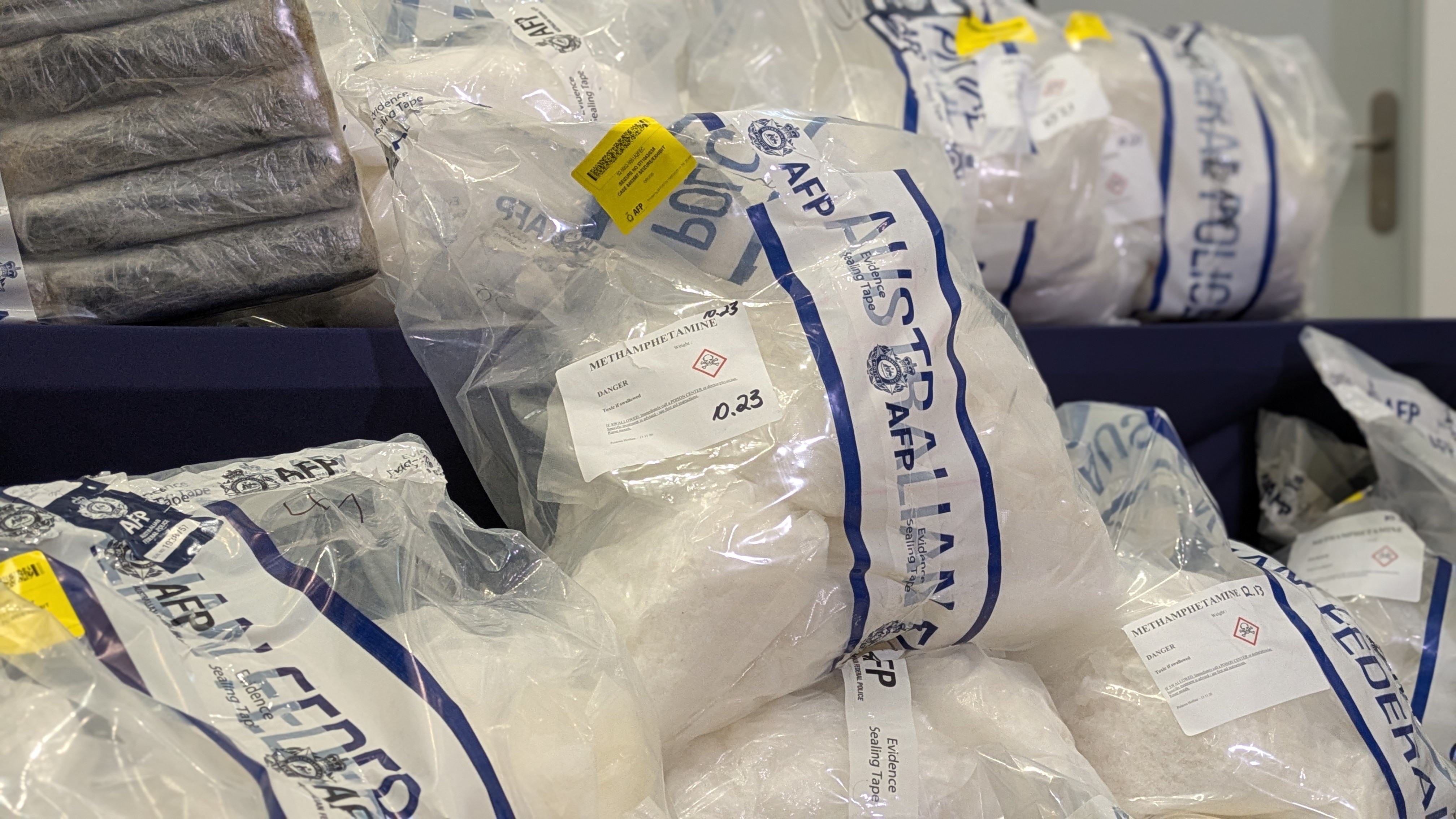 Evidence bags with large amounts of a white crystal substance in them. 