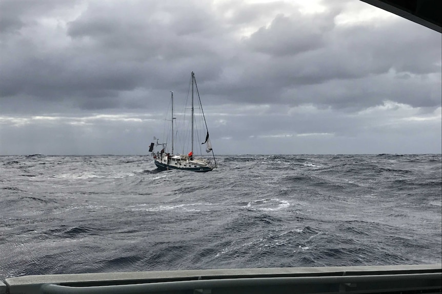 A 12-metre yacht bobs around in strong winds.