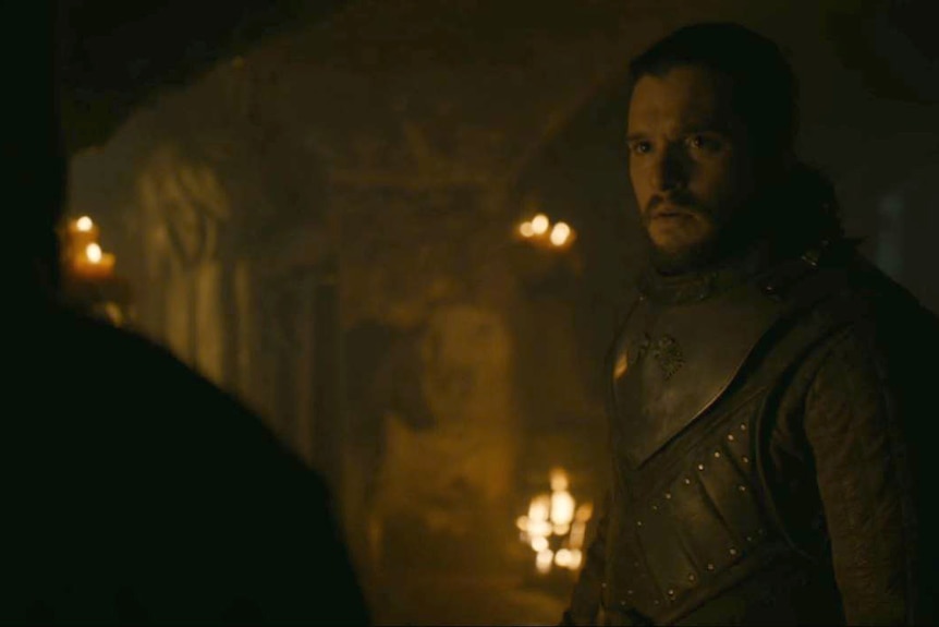 A shocked Jon listens to Sam in the crypt below Winterfell.