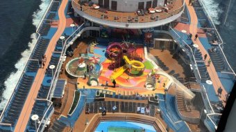 Aerial view of the waterslides and pool on top of the cruise ship, Ovation of the Seas