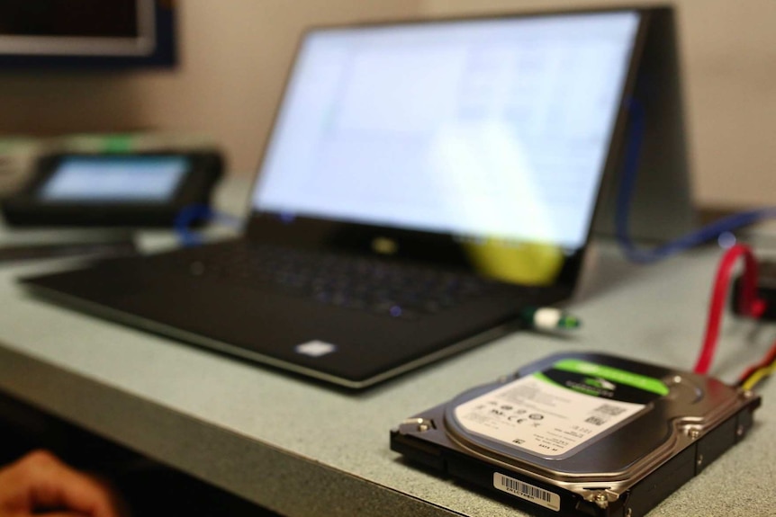 a laptop connected to a hard drive