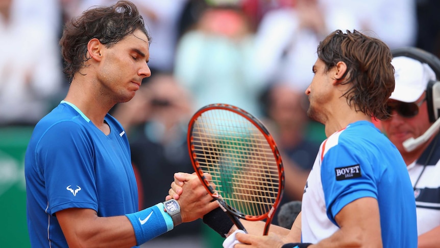 Spain's David Ferrer is congratulated by Rafael Nadal after Ferrer won at Monte Carlo.