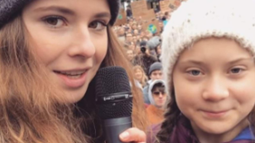Greta Thunberg and Luisa Neubauer speak at a rally.