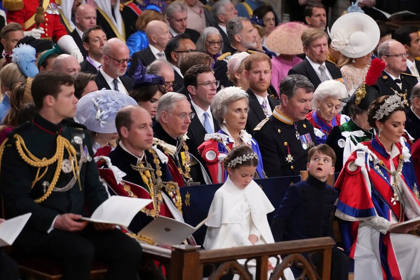 The royal family seated in the front rows of Westminster Abbey