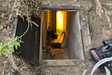 An underground bunker with camouflage