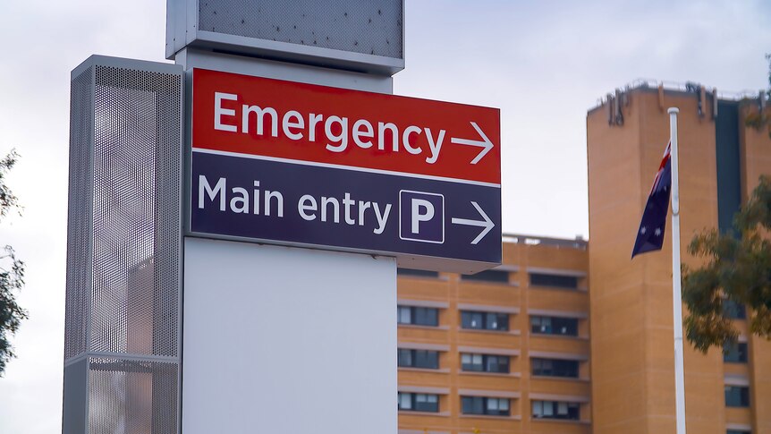 A sign points to Canberra Hospital's emergency department.