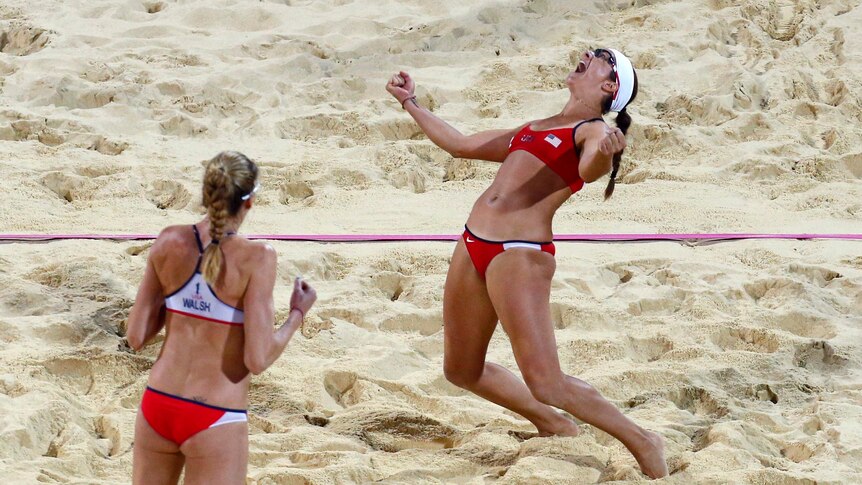 Kerri Walsh Jennings and Misty May-Treanor celebrate winning the beach volleyball gold medal.