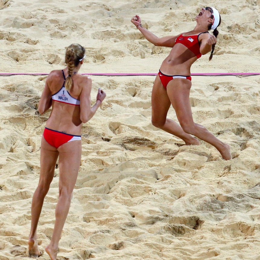 Kerri Walsh Jennings and Misty May-Treanor celebrate a third consecutive Olympic title.