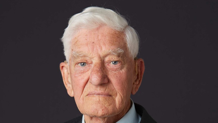 Portrait of an elderly man wearing war medals