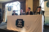 A panel of politicians sit at a table alongside AMA SA president Professor William Tam.