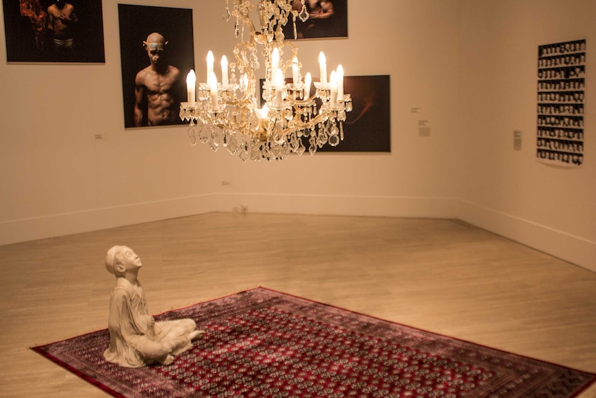 Wednesday's child, 2013 (tinted resin, carpet, chandelier) by Abdul-Rahman Abdullah.