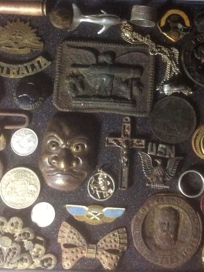 A tray of metal items collected by metal detector enthusiast