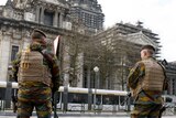 Belgian soldiers stand guard outside Palace of Justice