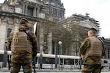 Belgian soldiers stand guard outside Palace of Justice