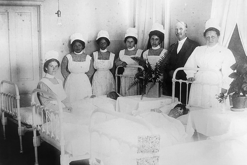 Children in a hospital bed.