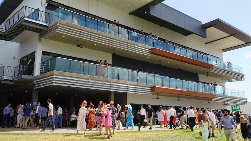 The Darwin Turf Club grandstand packed with spectators on a Darwin race day.
