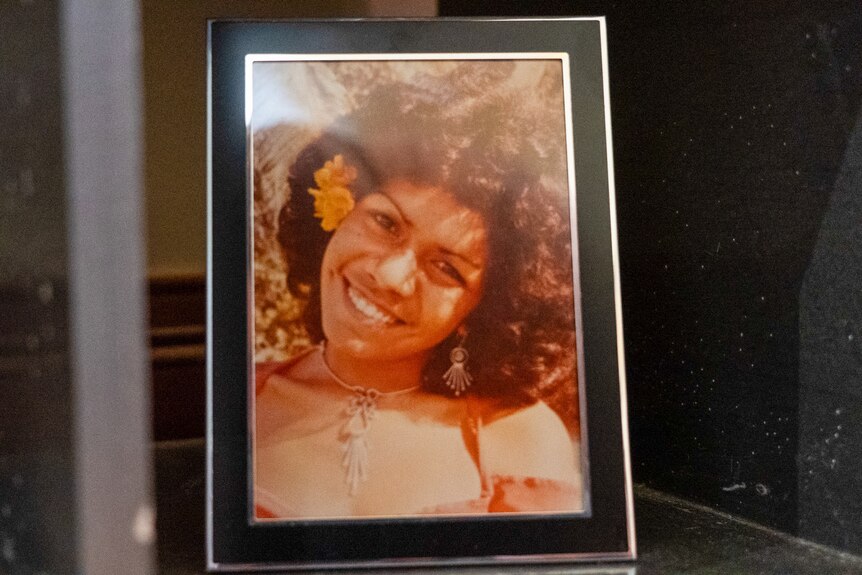 a framed photo of a young woman