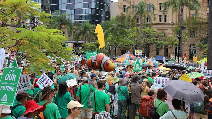 Thousands gather in Queen's Park for a climate action rally through Brisbane.