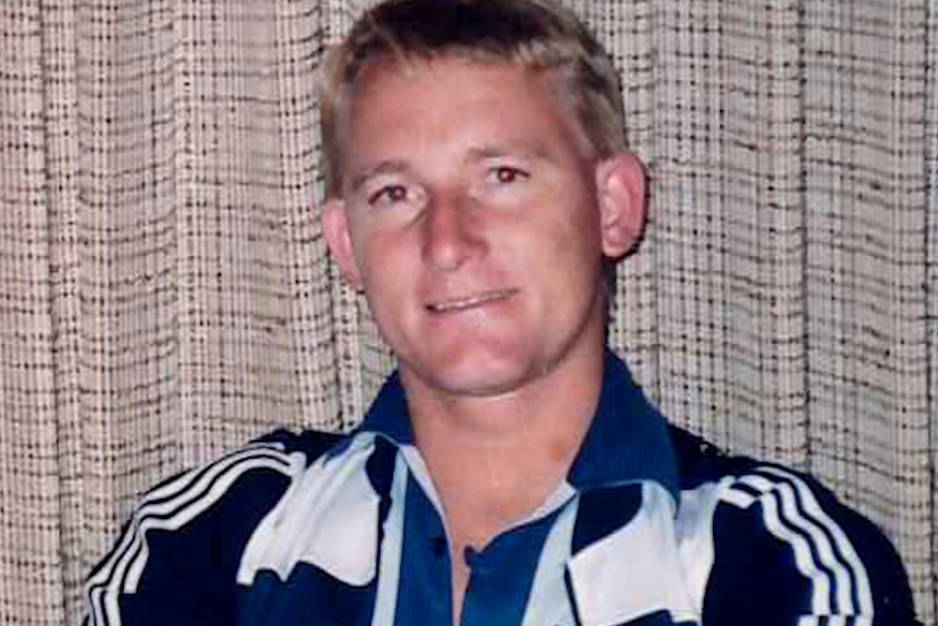 A photograph of a man aged in his 20s with blonde hair