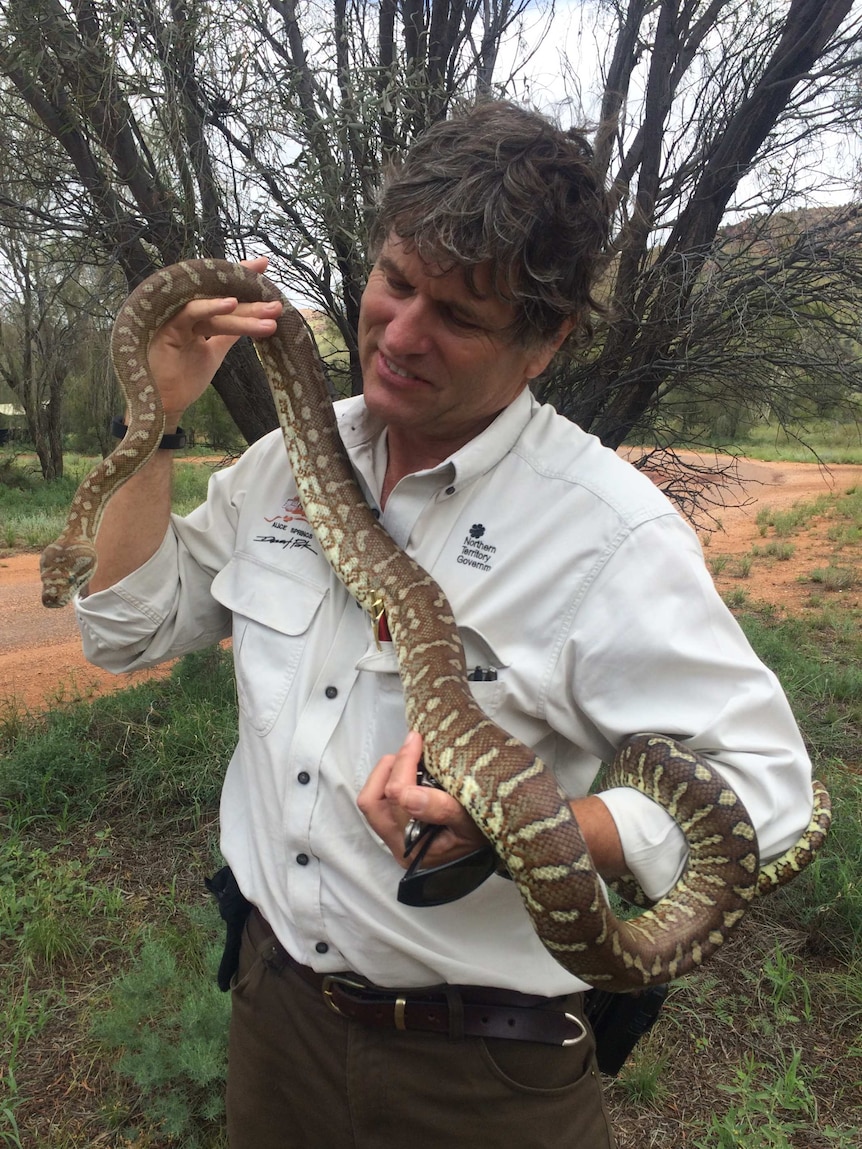 Scott Pullyblank with a carpet python