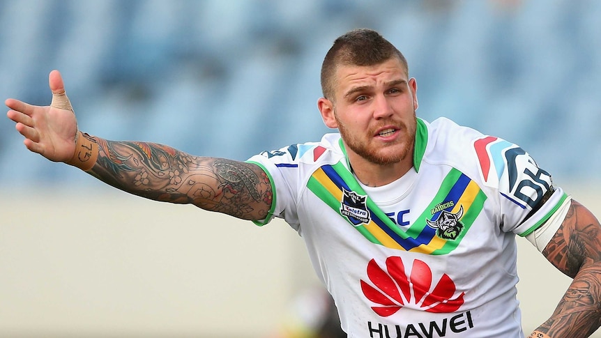 Josh Dugan on the sidelines during an NRL trial match for the Canberra Raiders in February.