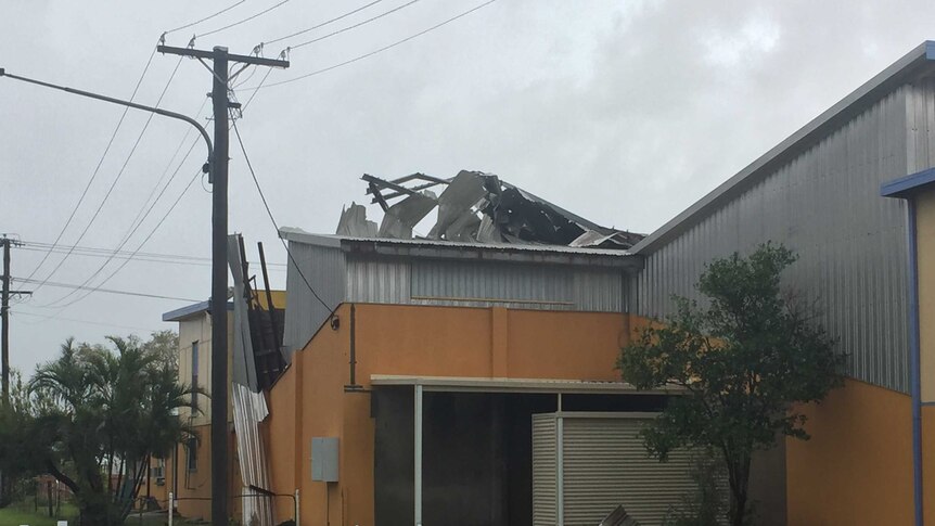 The roof of the Bowen Squash courts is torn from the structure.