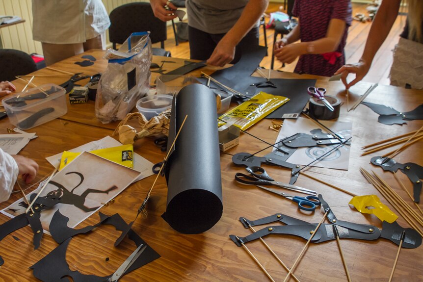 Skewers, cardboard and split pins come together to make the puppets move.