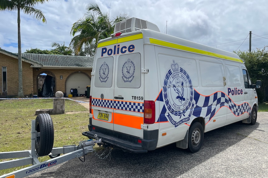 A police van outside a home where a body was discovered in Tweed Heads