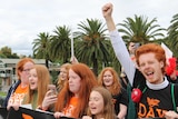 Participants of the 2017 ginger pride parade march on Swanston Street in Melbourne.