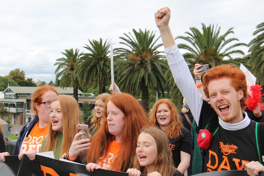 Participants of the 2017 ginger pride parade march on Swanston Street in Melbourne.