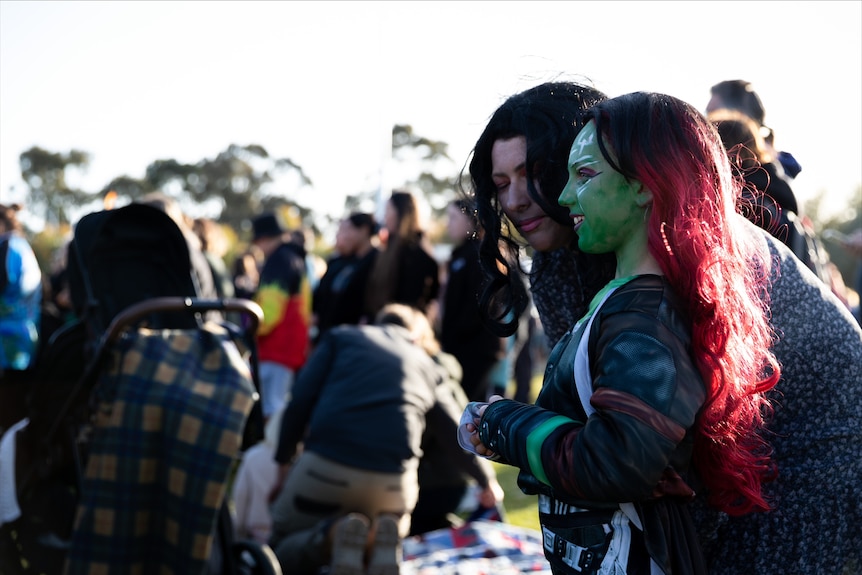 Two women in fancy dress at the memorial for Cassius Turvey. 