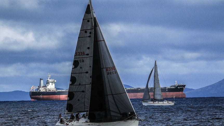 Yacht sailing with crew on board