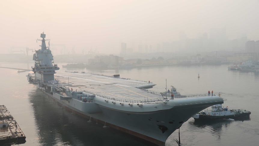 China's first home-built aircraft carrier leaves port.
