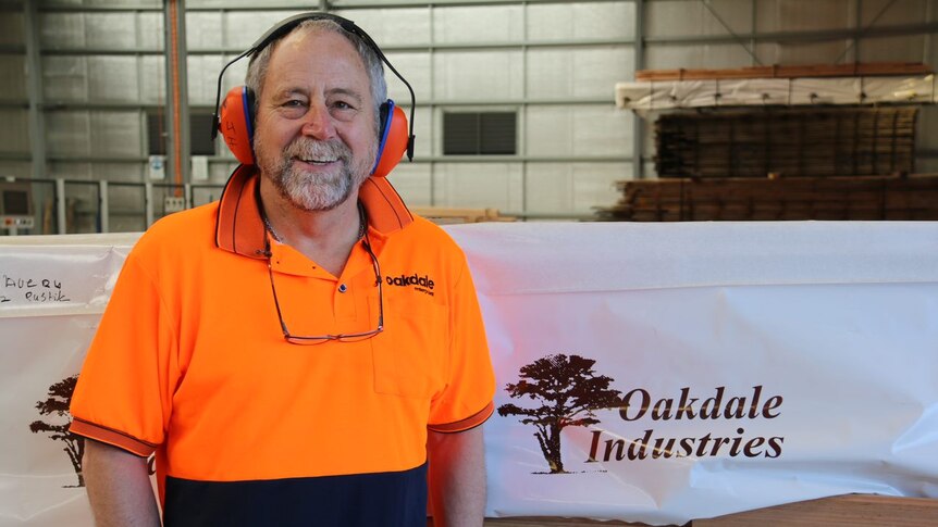 John Hollis from Oakdale Industries wears earmuffs in a workshop.