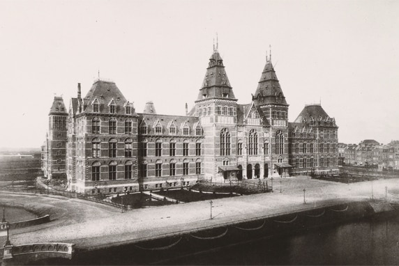 An old black and white photo of the Rijksmuseum when it first opened in 1885.