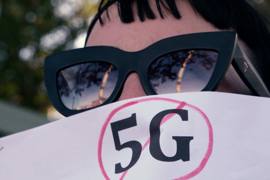 A protester at a recent rally against the 5G rollout.